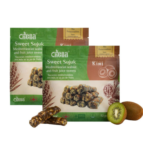 Packaging of Chella FruityNuts bar, featuring kiwi walnut flavor. Includes kiwi halves and stacked bars.