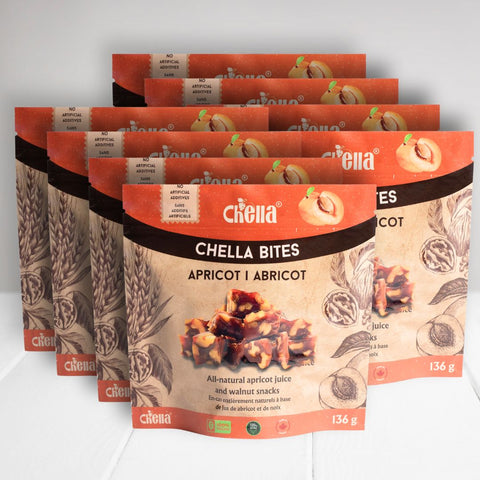 12 pack of apricot walnut Chella Bites. Orange packaging with apricot images, labeled 136g, all-natural, no artificial additives.