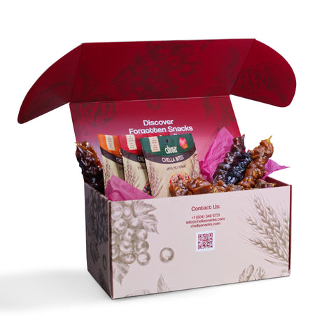 Open snack box with "Discover Forgotten Snacks with Chella" text, filled with colorful treats and pink tissue paper. Box has contact info and decorative sketches.