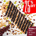 Assortment of 12 grapes churchkhelas on a wooden board, surrounded by walnuts, grapes, and wheat on a white background. Red tags display '25% off'
